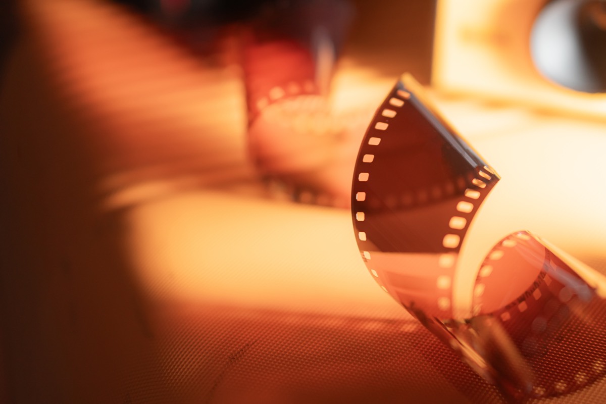 Analog film strip glowing in warm light